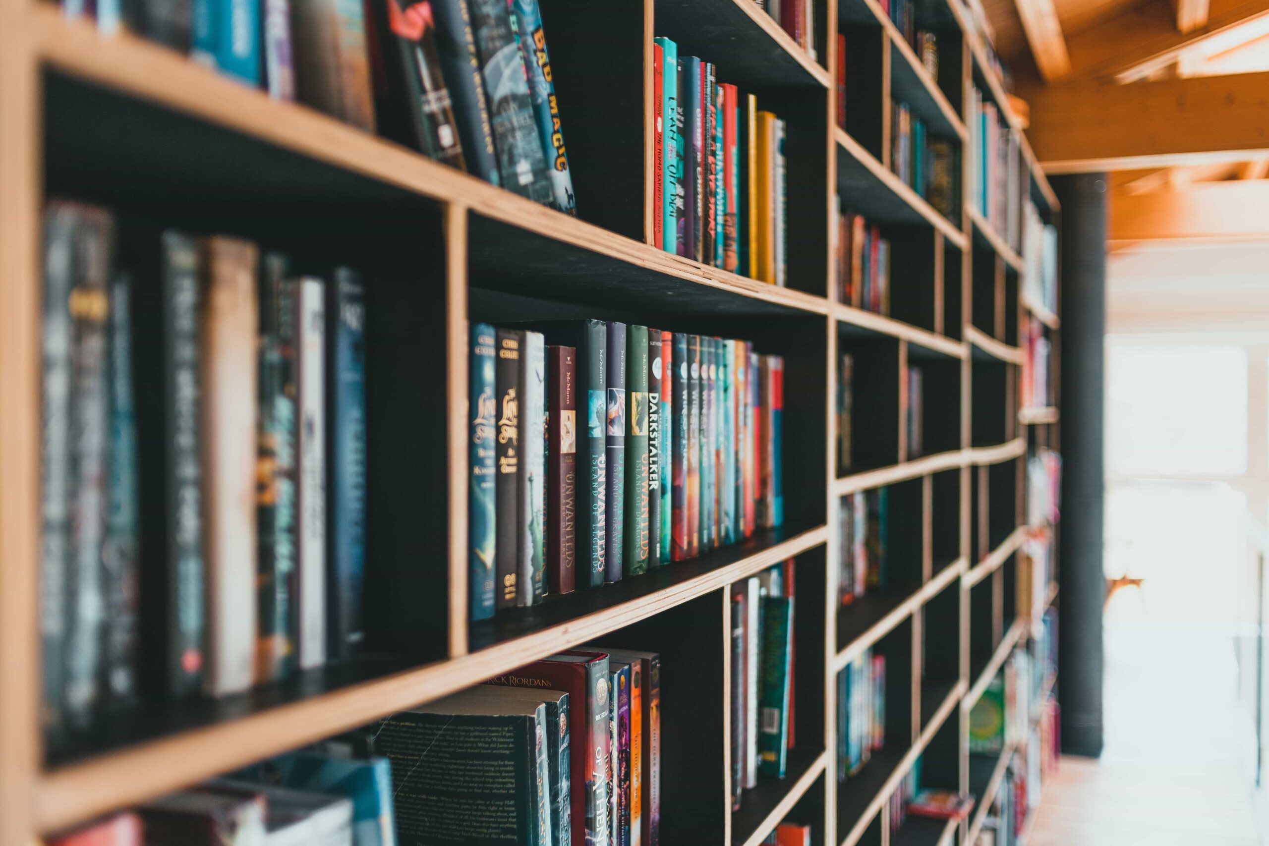 A large wooden bookshelf filled with books.
